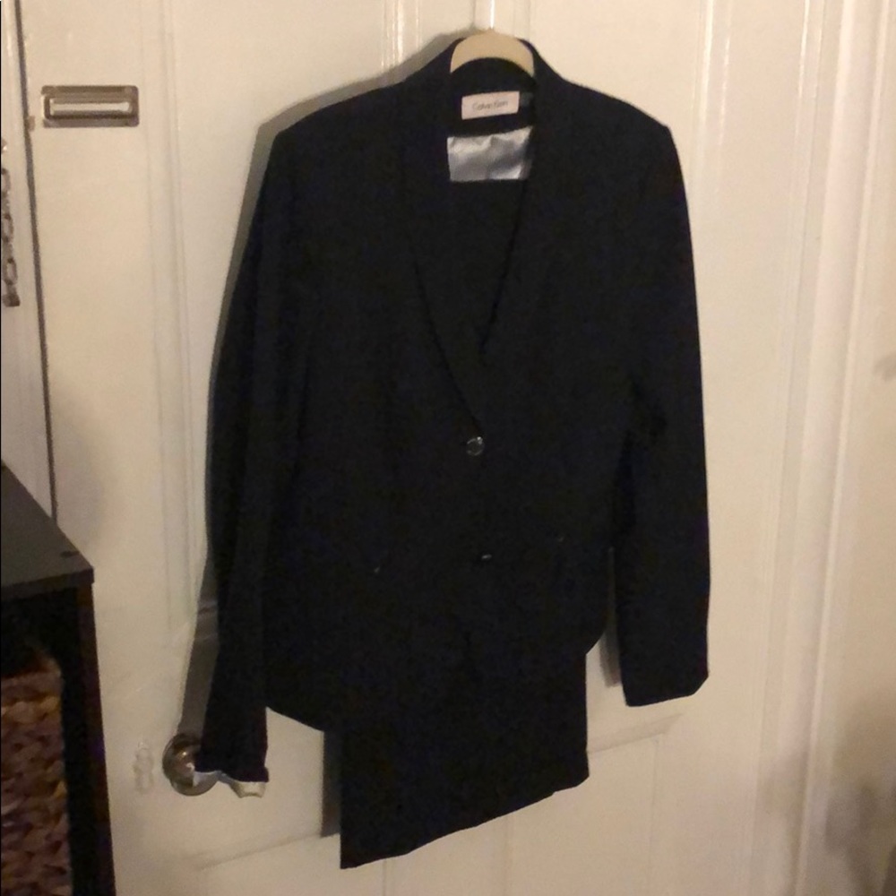 black Calvin Klein suit jacket and pants